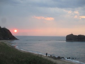 夕日とカメラマン